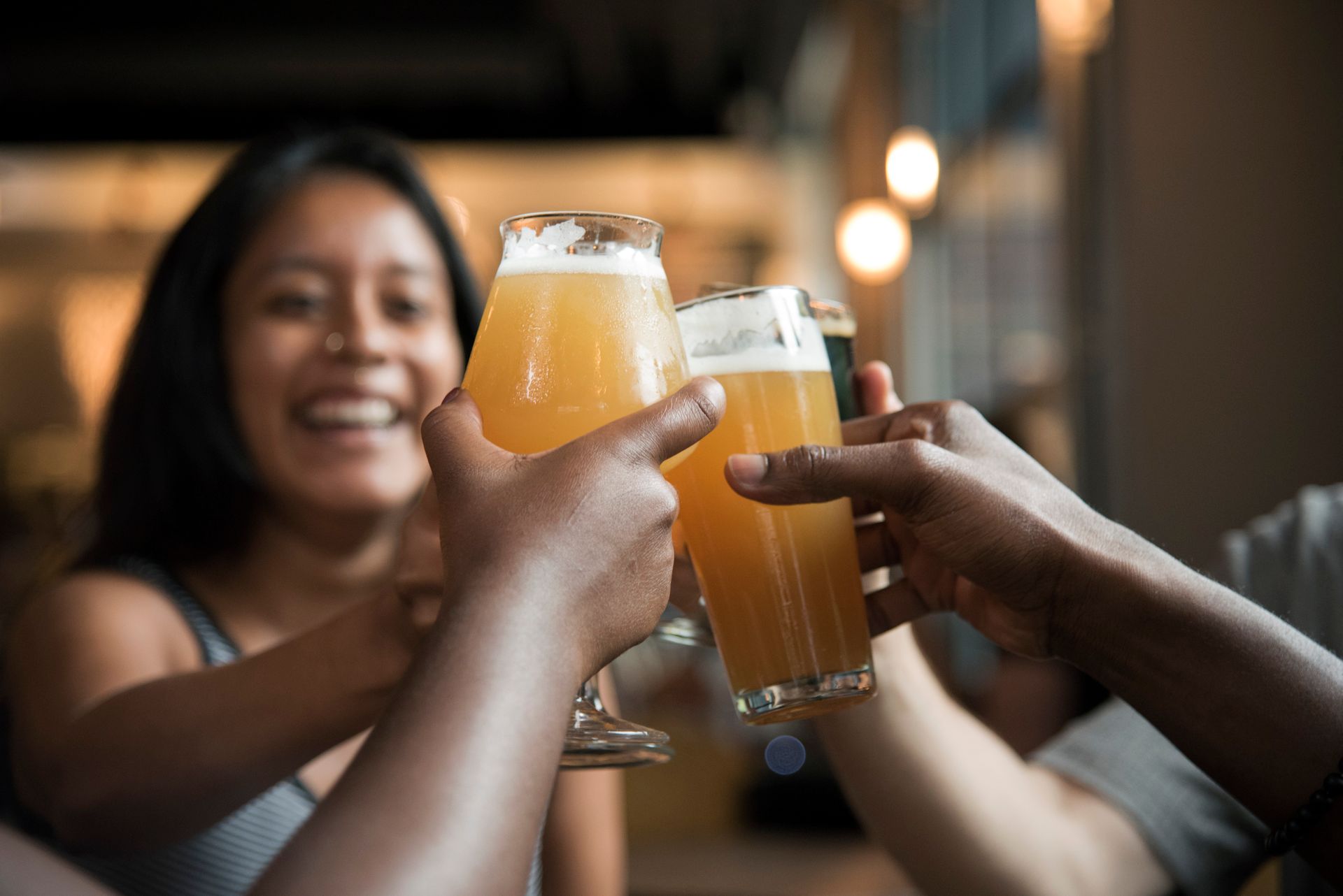 Glasses raised in a toast at the pub