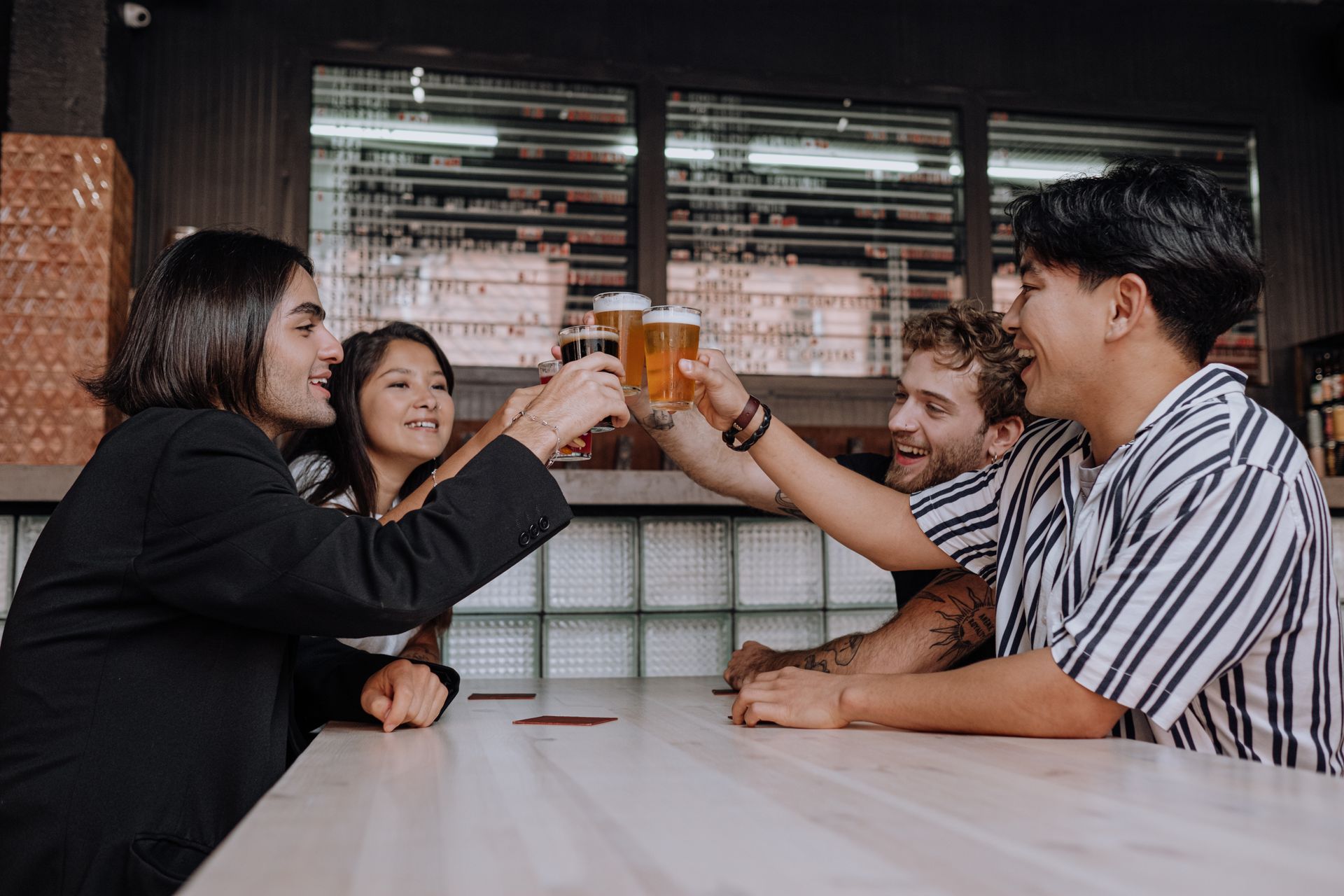Friends raising a toast at the bar